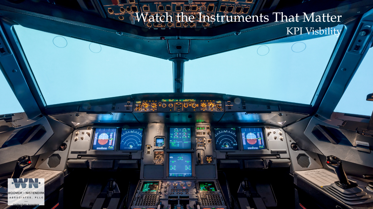 Business owner monitoring key performance indicators on an aircraft-style dashboard to illustrate KPI visibility, financial reporting, and business decision-making.