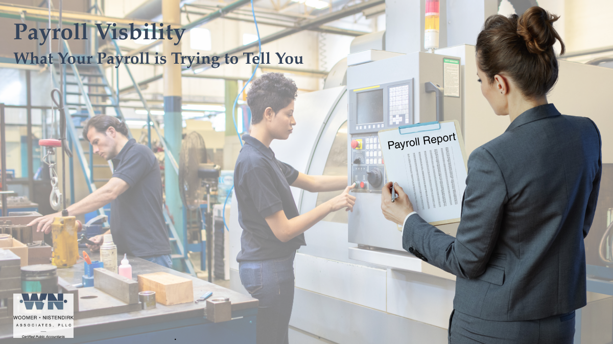 Business manager reviewing payroll reports to analyze labor costs, staffing trends, and payroll visibility.